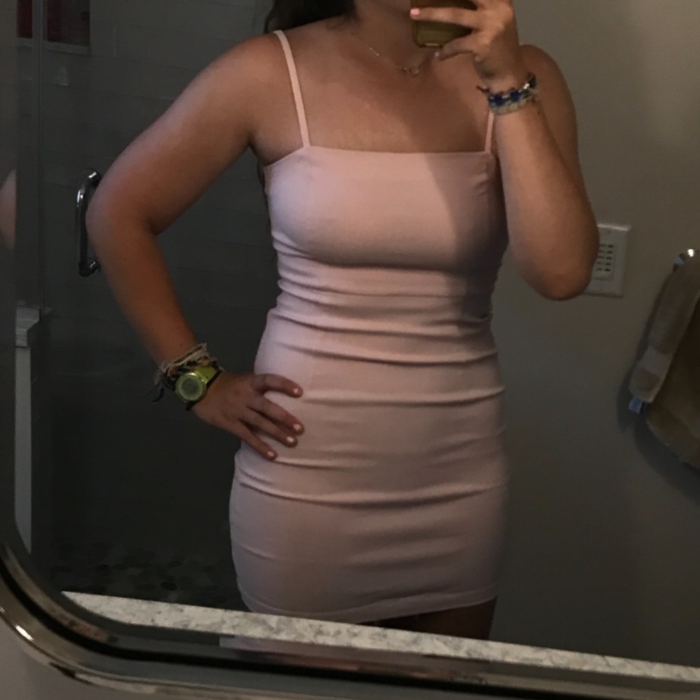 Light pink mini dress with adjustable straps and zip back
